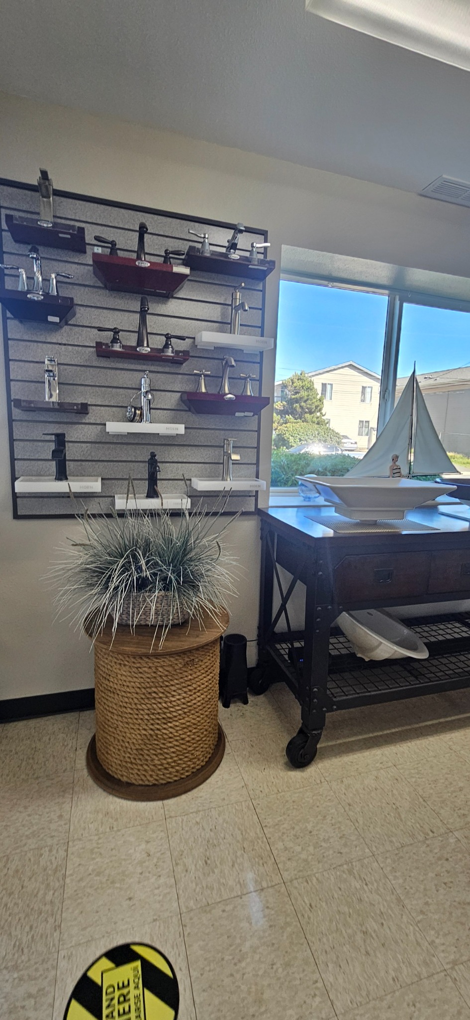 Faucet displays and vessel sinks near the showroom window