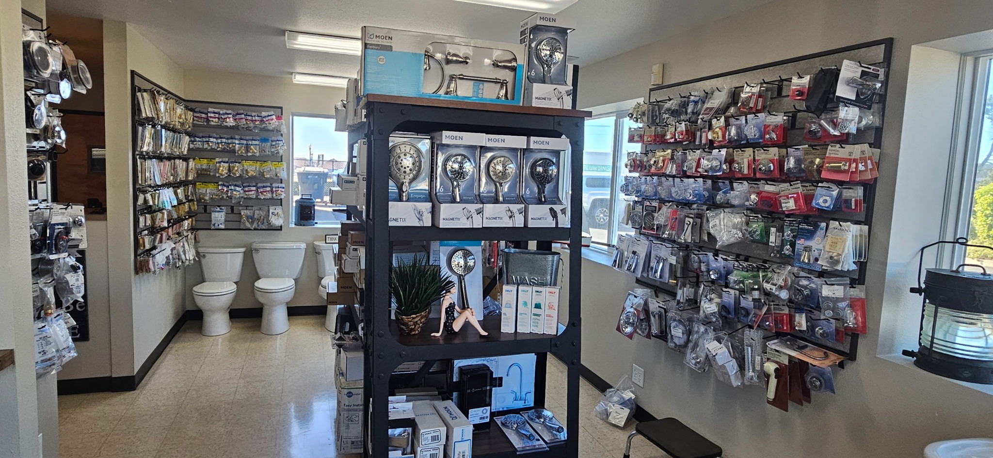 Shelves of plumbing parts and supplies at Newport Plumbing
