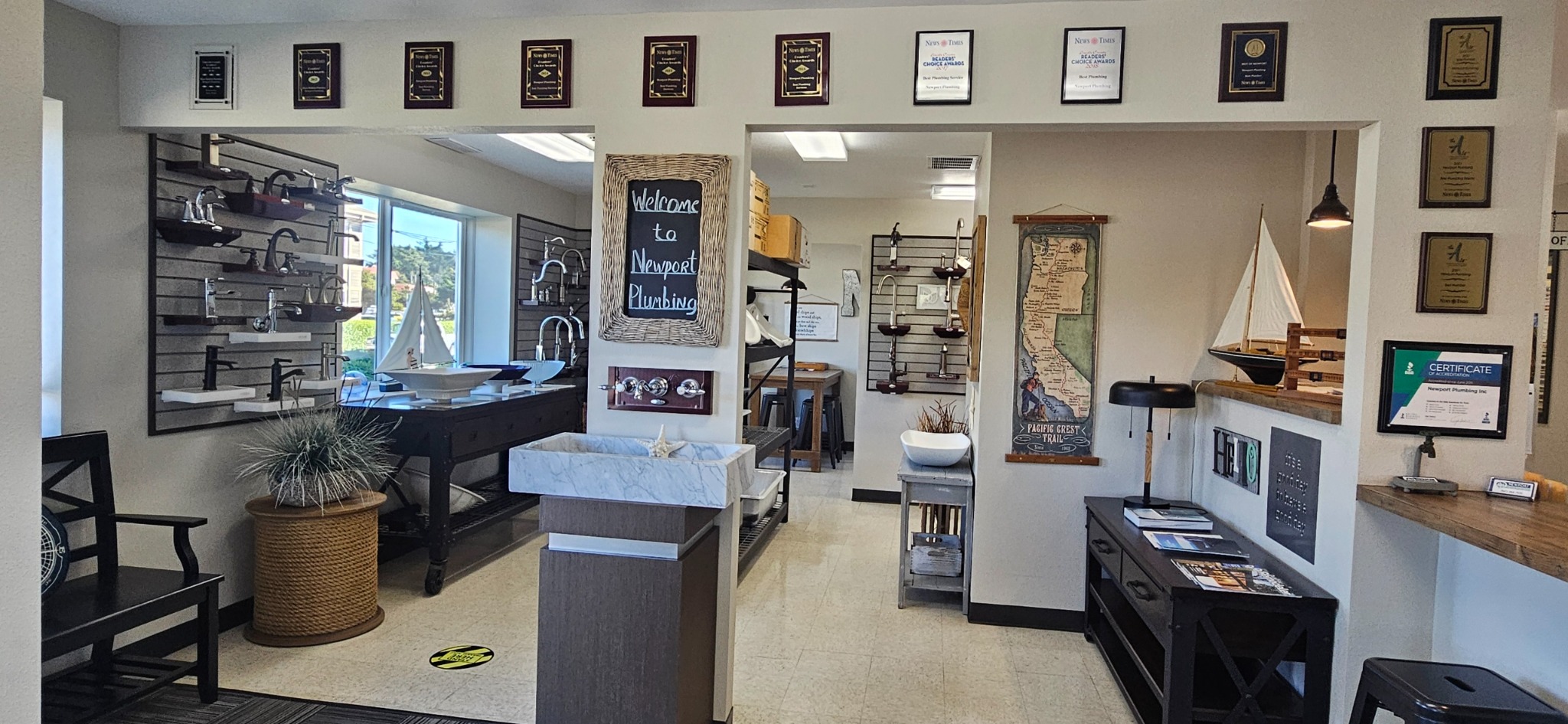 Inside Newport Plumbing’s showroom, with sinks, faucets, and fixture displays