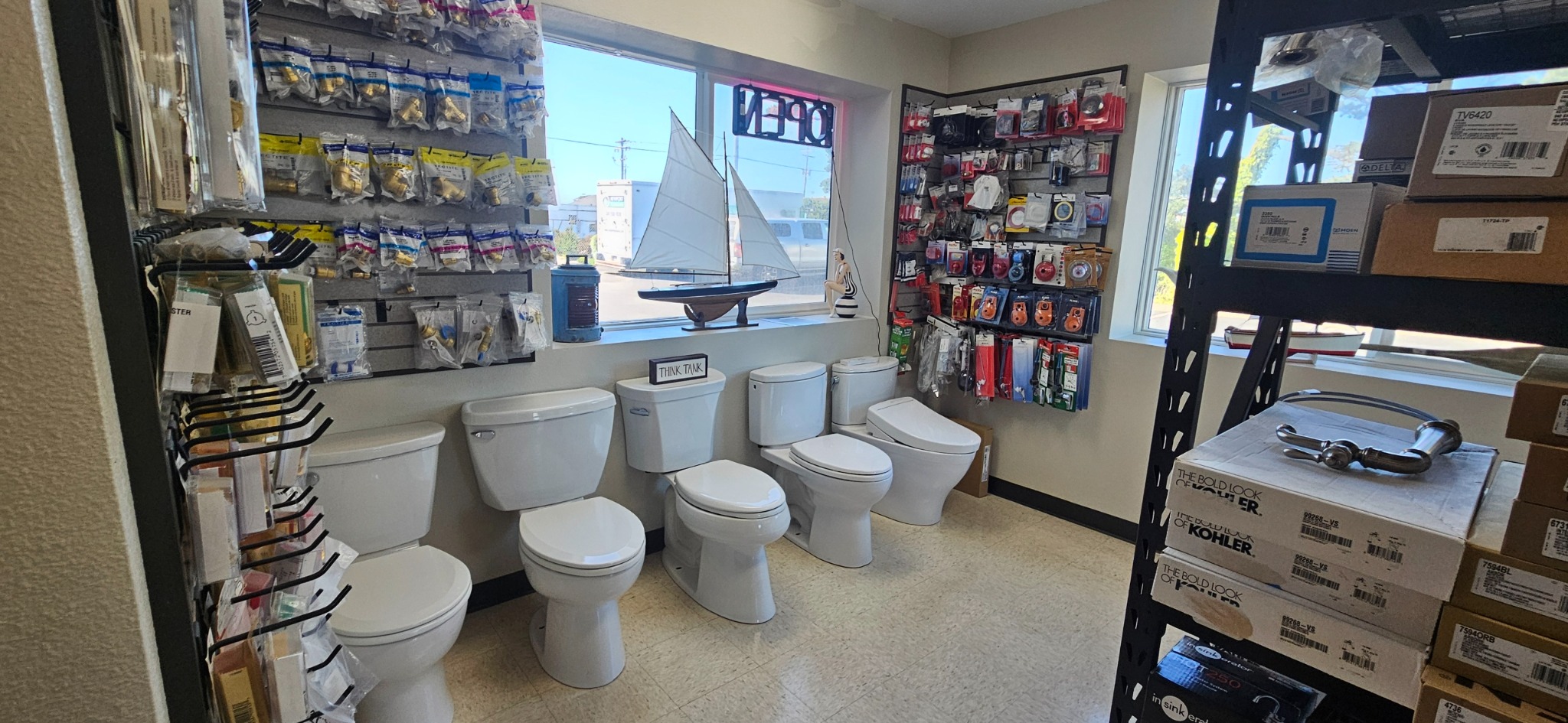 Toilet models and plumbing accessories on display in the showroom